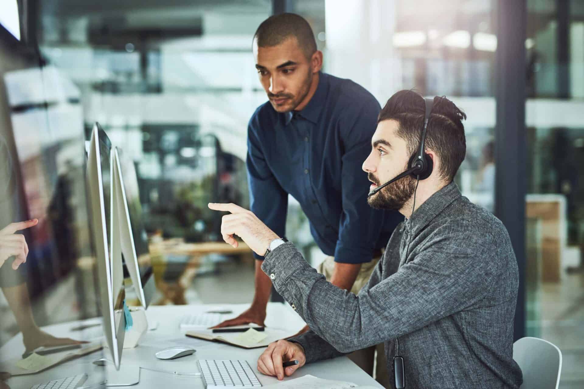 Healthcare & Federal Government Agencies’ Challenges for 2023 3 colleague helping support technology zayo scaled 1