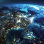 A Digital map of North America showing global network connections, data transfer and connectivity between the USA, Canada and Mexico depicted in space over the earth at night.