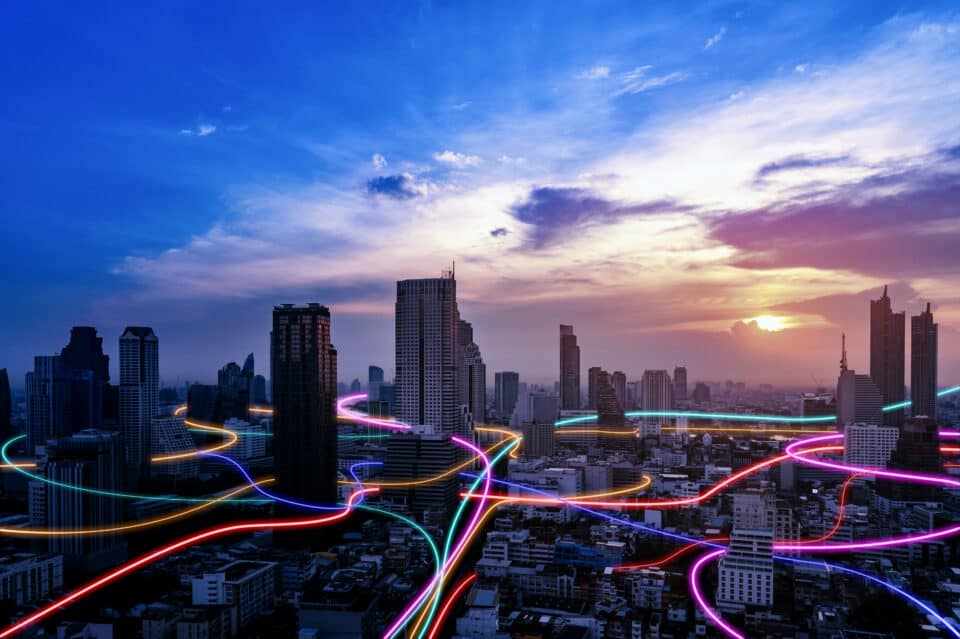 Smart city with speed line glowing light trail surround the city. big data connection technology concept.
