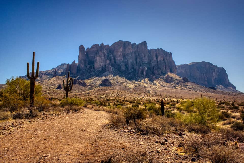 Iconic view of Superstition Mountains and Saguaro cacti in Lost Dutchman State Park, Arizona from Treasure Loop Trail